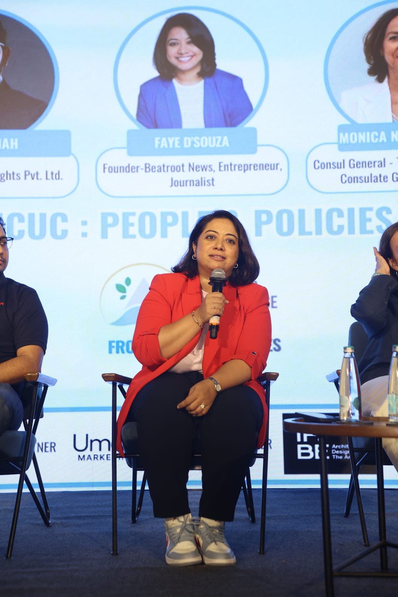 A panellist speaking on stage during the People and Policies session